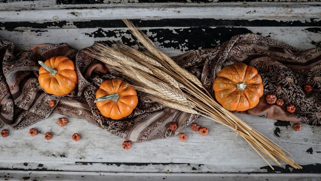 Autumn harvest of apples, mushrooms and pumpkins on a rustic table
