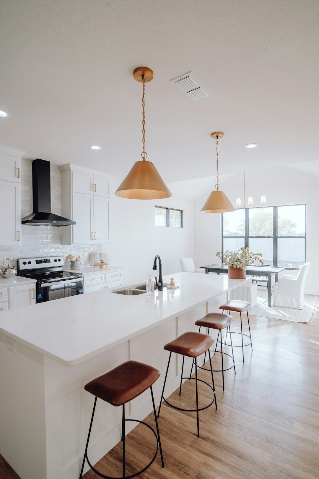 Bright modern Czech home kitchen with wooden countertop and fresh ingredients